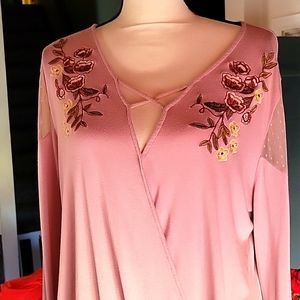 Pullover top with floral design..banded bottom..cold shoulder sleeve section